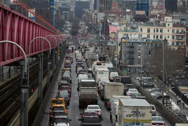 Traffic crosses the Williamsburg bridge in New York from Brooklyn into Manhattan on a typical morning.